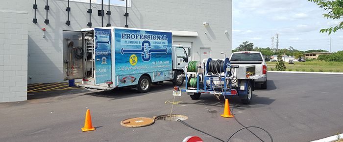 Professional Plumbing & Design truck restoring flow of water after locating a blockage.