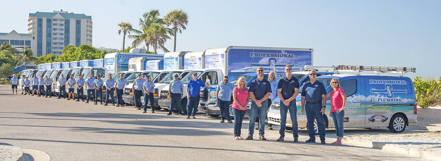 The Professional Plumbing & Design team with the Ringling Causeway and Sarasota Bay in the background.